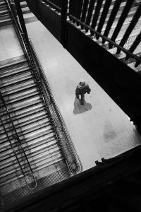 A black and white image of a figure on a ramp